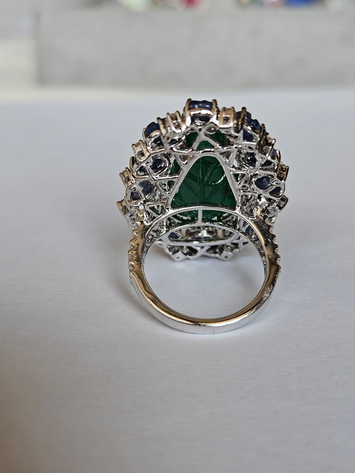 Round Cut Set in 18K Gold, carved Zambian Emerald, Blue Sapphires & Diamonds Cocktail Ring For Sale