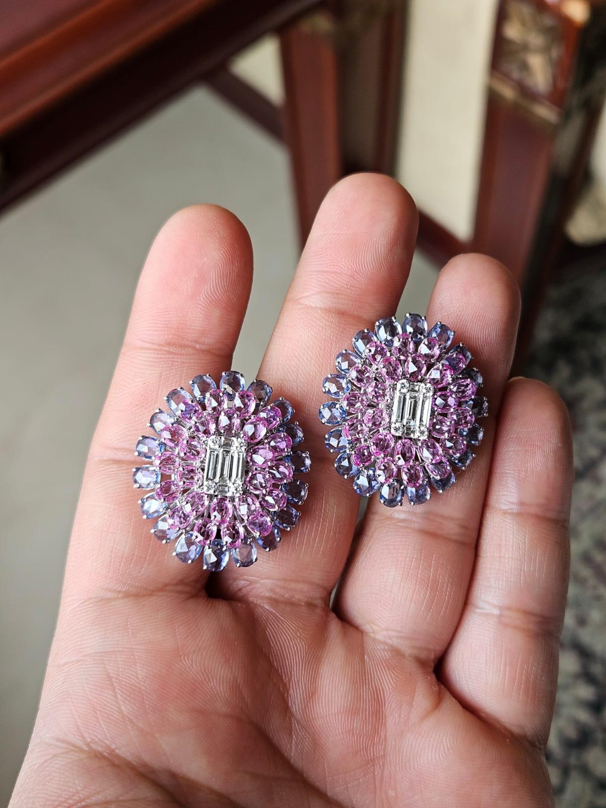 A very gorgeous and beautiful,. Pink & Blue Sapphires Stud Earrings set in 18K White Gold & natural Diamonds. The weight of the Blue Sapphires is 9.61 carats. The weight of the Pink Sapphires is 8.81 carats. The Blue & Pink Sapphires are of Ceylon