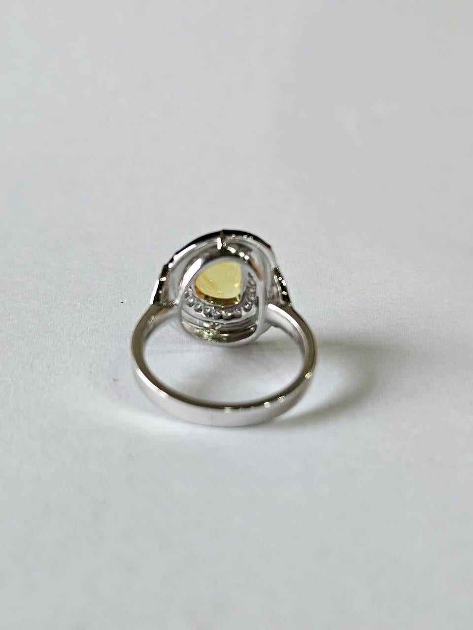 A very gorgeous and beautiful, Yellow Sapphire & Black Enamel Cocktail Engagement Ring set in 18K White Gold & natural Diamonds. The weight of the un-even shaped, Yellow Sapphire Rose Cut is 1.45 carats. The Yellow Sapphire is of Ceylon (Sri Lankan)