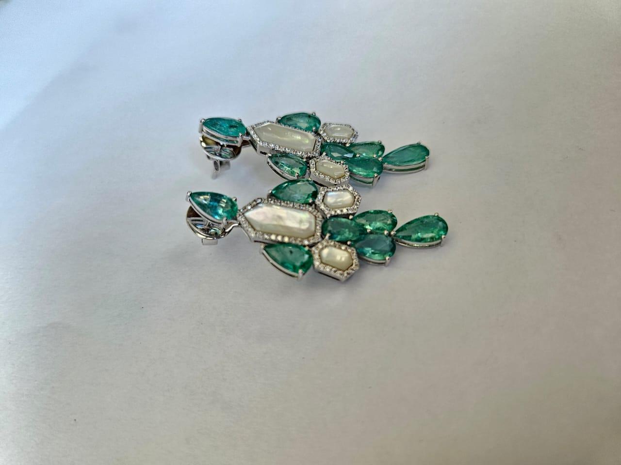 A very gorgeous and beautiful, Emerald & Pearl Chandelier Earrings set in 18K White Gold & natural Diamonds. The weight of the Emerald is 10.55 carats. The Emeralds are completely natural, without any treatment and are of Colombian origin. The