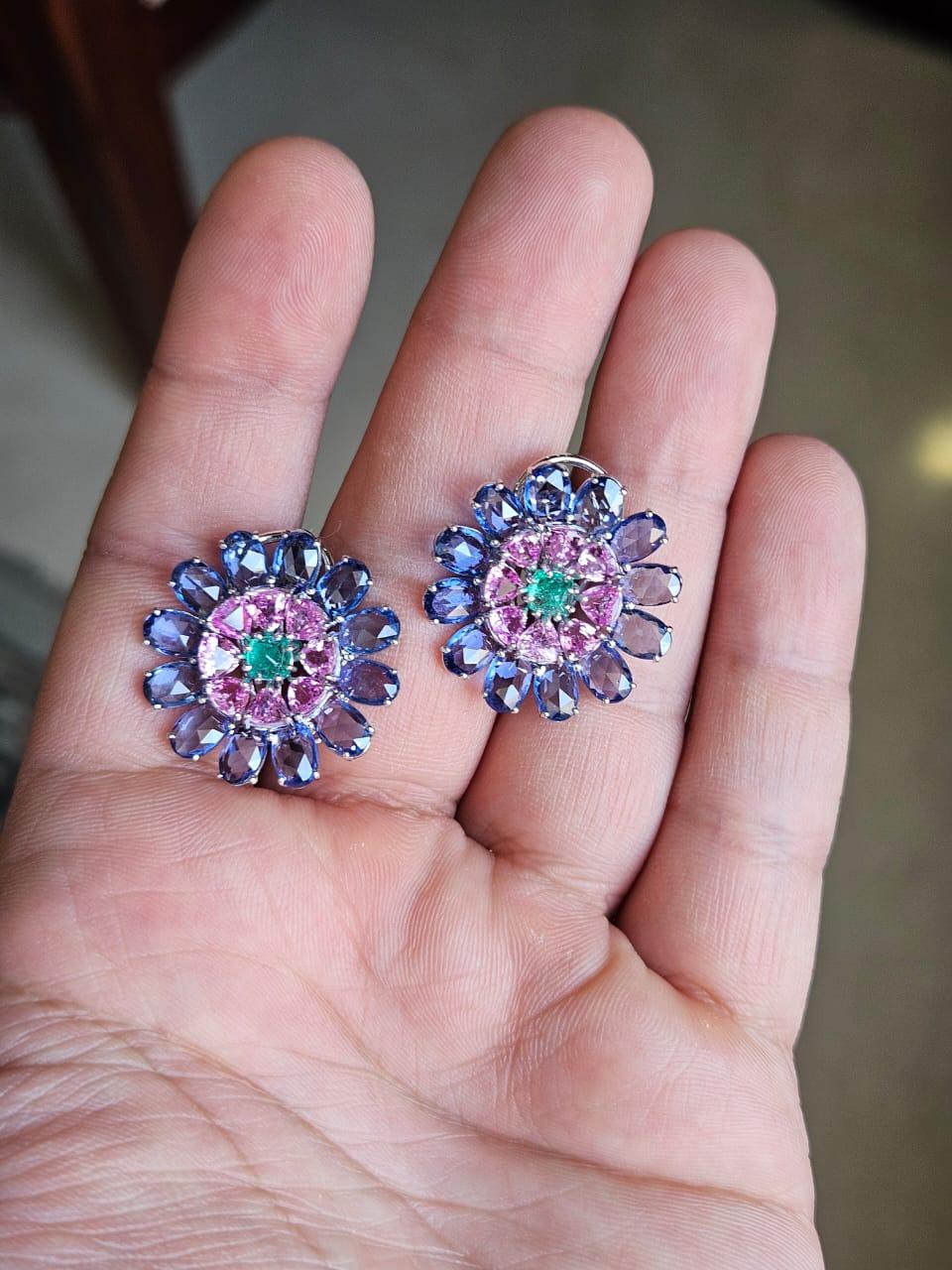 A very gorgeous and beautiful, Emerald & Multi Sapphires Stud Earrings set in 18K White Gold. The weight of the Emerald Sugarloafs is 0.63 carats. The Emeralds are completely natural, without any treatment and are of Colombian origin. The combined