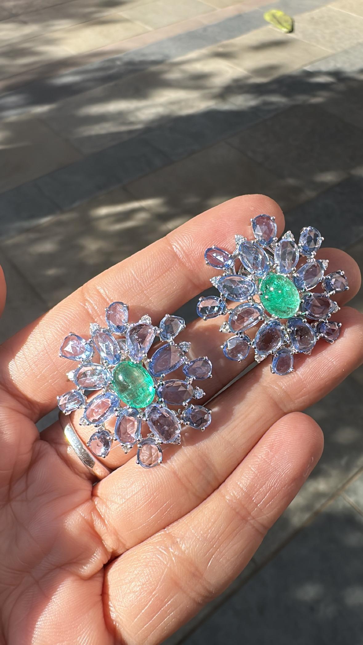 A very gorgeous and beautiful, modern style, Emerald & Blue Sapphires Stud Earrings set in 18K White Gold & natural Diamonds. The weight of the Emerald Cabochons is 4.28 carats. The Emeralds are completely natural, without any treatment and are of