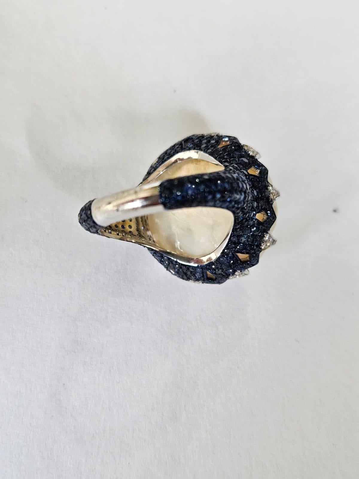 Oval Cut Set in 18K Gold, Emerald, Mother of Pearl, Blue Sapphire & Diamond Cocktail Ring For Sale