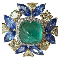 Set in 18K Gold, Emerald sugarloaf, Blue Sapphires & Diamonds Cocktail Ring