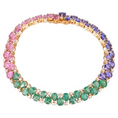 Bracelet moderne en or 18 carats, émeraudes, saphirs roses, tanzanites et diamants