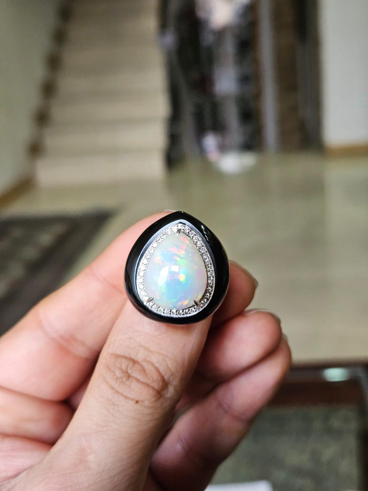 A very gorgeous and beautiful, Art Deco style, Opal & Black Onyx Dome Cocktail Ring set in 18K White Gold & natural Diamonds. The weight of the Ethiopian Opal is 8.31 carats. The weight of the Black Onyx is 32.97 carats. The Diamonds weight is 0.32
