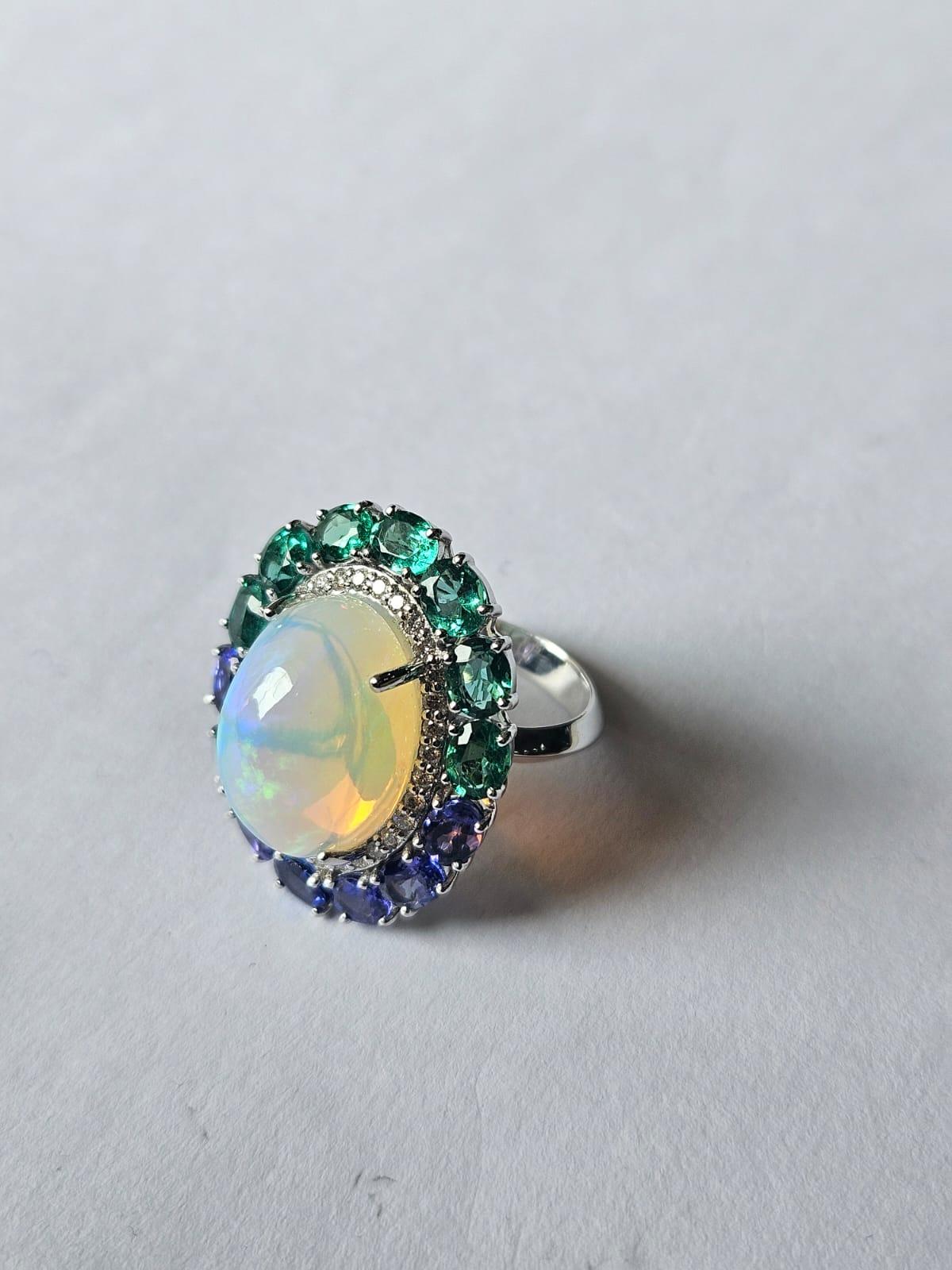 Set in 18K Gold, Ethiopian Opal, Emeralds, Tanzanites & Diamonds Cocktail Ring For Sale 4