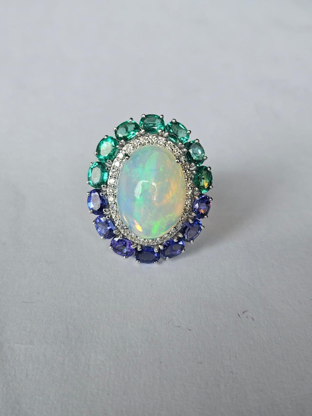 Set in 18K Gold, Ethiopian Opal, Emeralds, Tanzanites & Diamonds Cocktail Ring For Sale 5