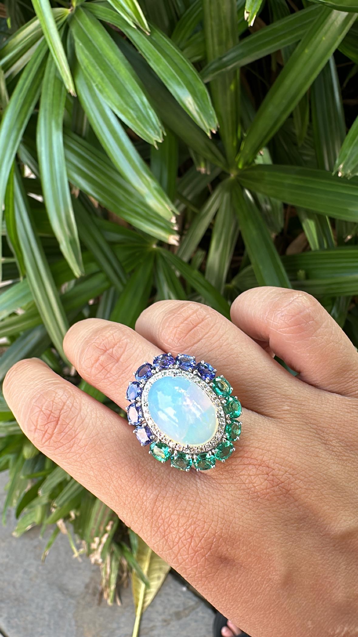 Oval Cut Set in 18K Gold, Ethiopian Opal, Emeralds, Tanzanites & Diamonds Cocktail Ring For Sale