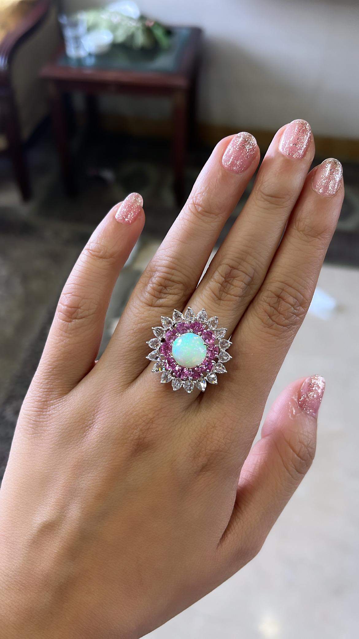 A very beautiful and one of a kind, Opal & Pink Sapphire Cocktail / Dome Ring set in 18K White Gold & Diamonds. The weight of the Opal is 2.60 carats. The Opal is completely natural, without any treatment and is of Ethiopian origin. The weight of