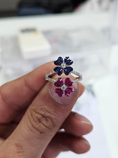 Set in 18K Gold, invisible set Blue Sapphires, Rubies & Diamonds Cluster Ring