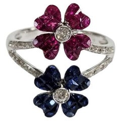 Set in 18K Gold, invisible set Blue Sapphires, Rubies & Diamonds Cluster Ring