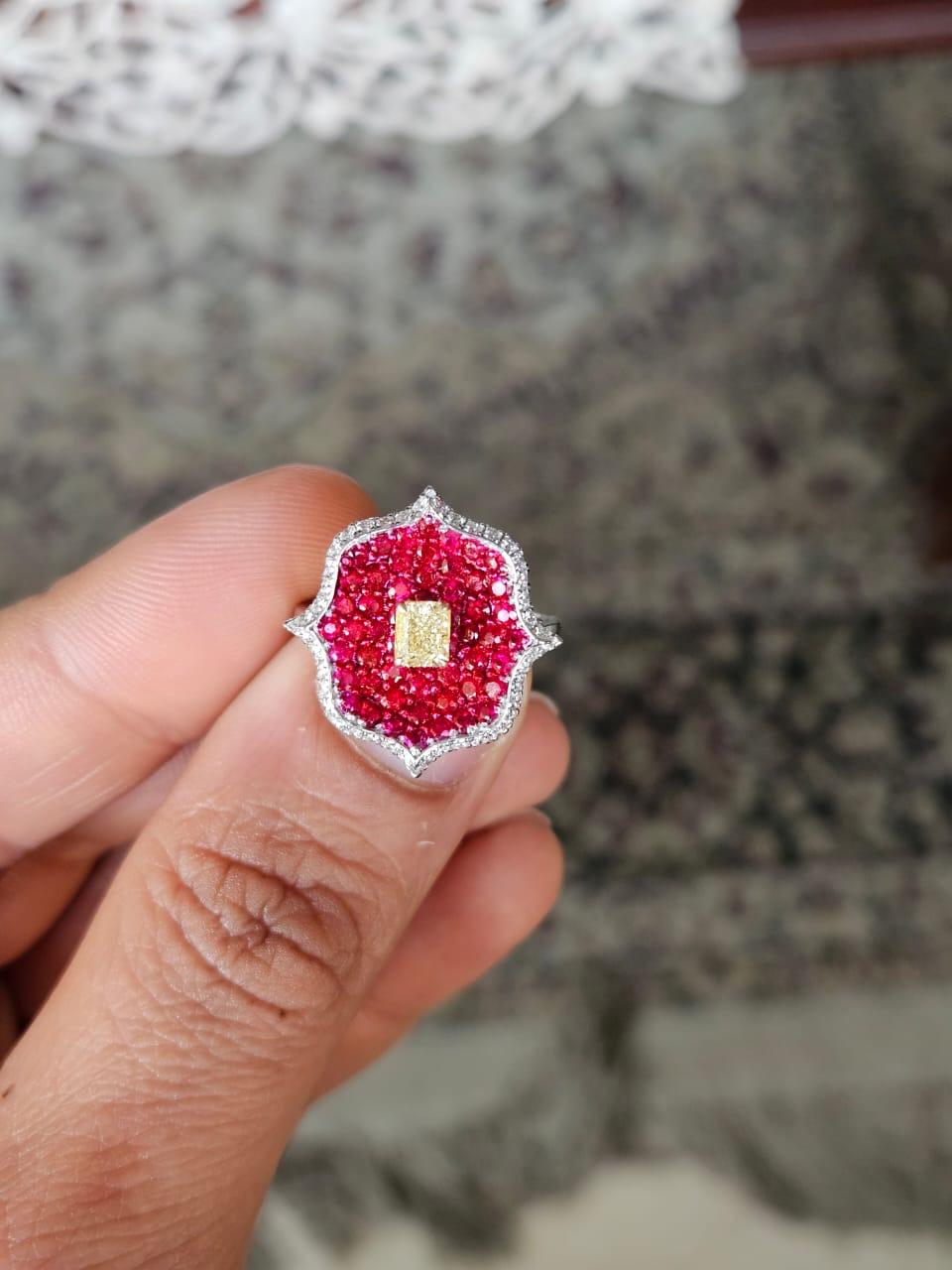 A very gorgeous and beautiful, modern style, Ruby & Yellow Diamond Engagement Ring set in 18K White Gold & natural Diamonds. The weight of the invisible set Rubies is 1.42 carats. The combined Diamonds weight of is 0.71 carats. Net 18K Gold weight