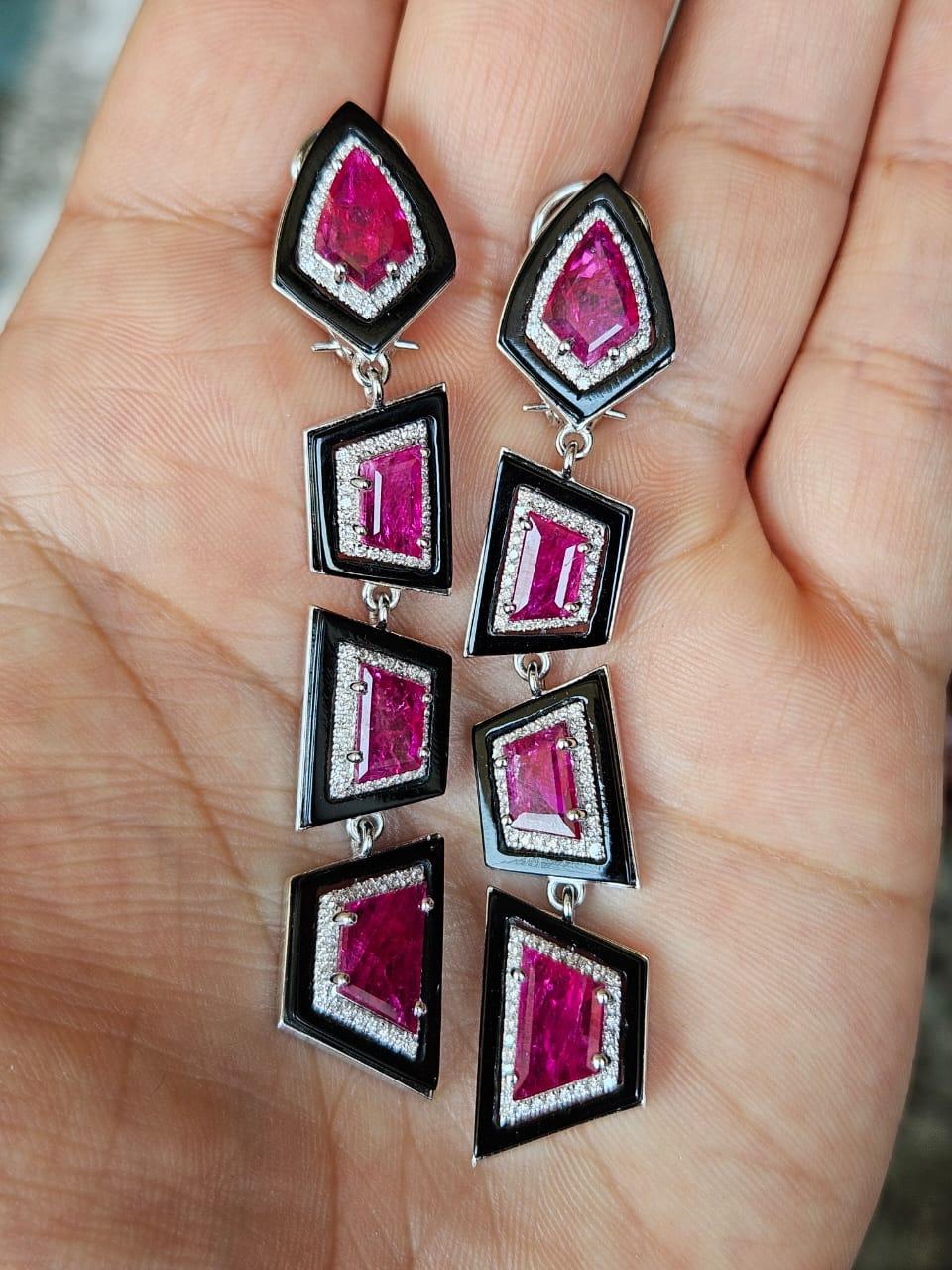 A very gorgeous and beautiful, Ruby & Black Onyx Chandelier Earrings set in 18K White Gold & natural Diamonds. The weight of the Rubies is 10.88 carats. The Rubies are completely natural, without any treatment and are of Mozambique origin. The