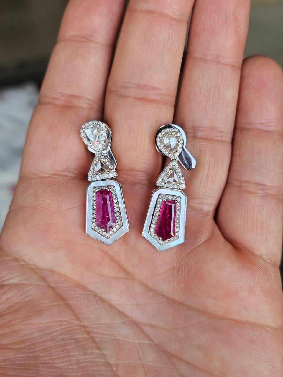 A very gorgeous and beautiful, modern style, Ruby & Pearl Dangle Earrings set in 18K White Gold & natural Diamonds. The weight of the Cadillac cut Rubies is 3.10 carats. The Rubies are completely natural, without any treatment and are of Mozambique