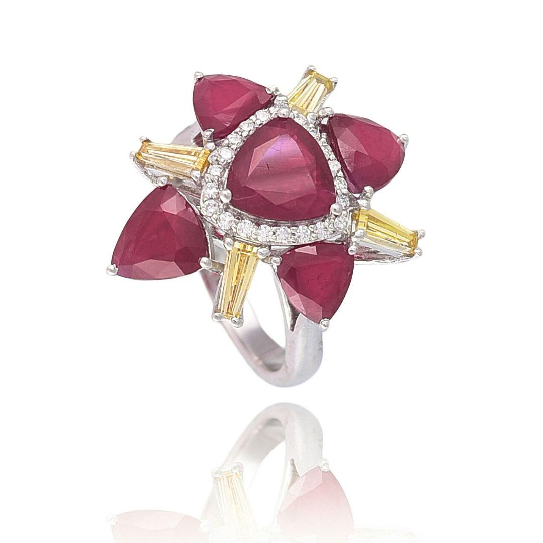 A very gorgeous and one of a kind, Mozambique Ruby & Baguette Diamonds Cocktail Ring. The combined weight of the Rubies is 6.46 carats. The Rubies are completely natural, no - heat and without any treatment. The Rubies originate from Mozambique,