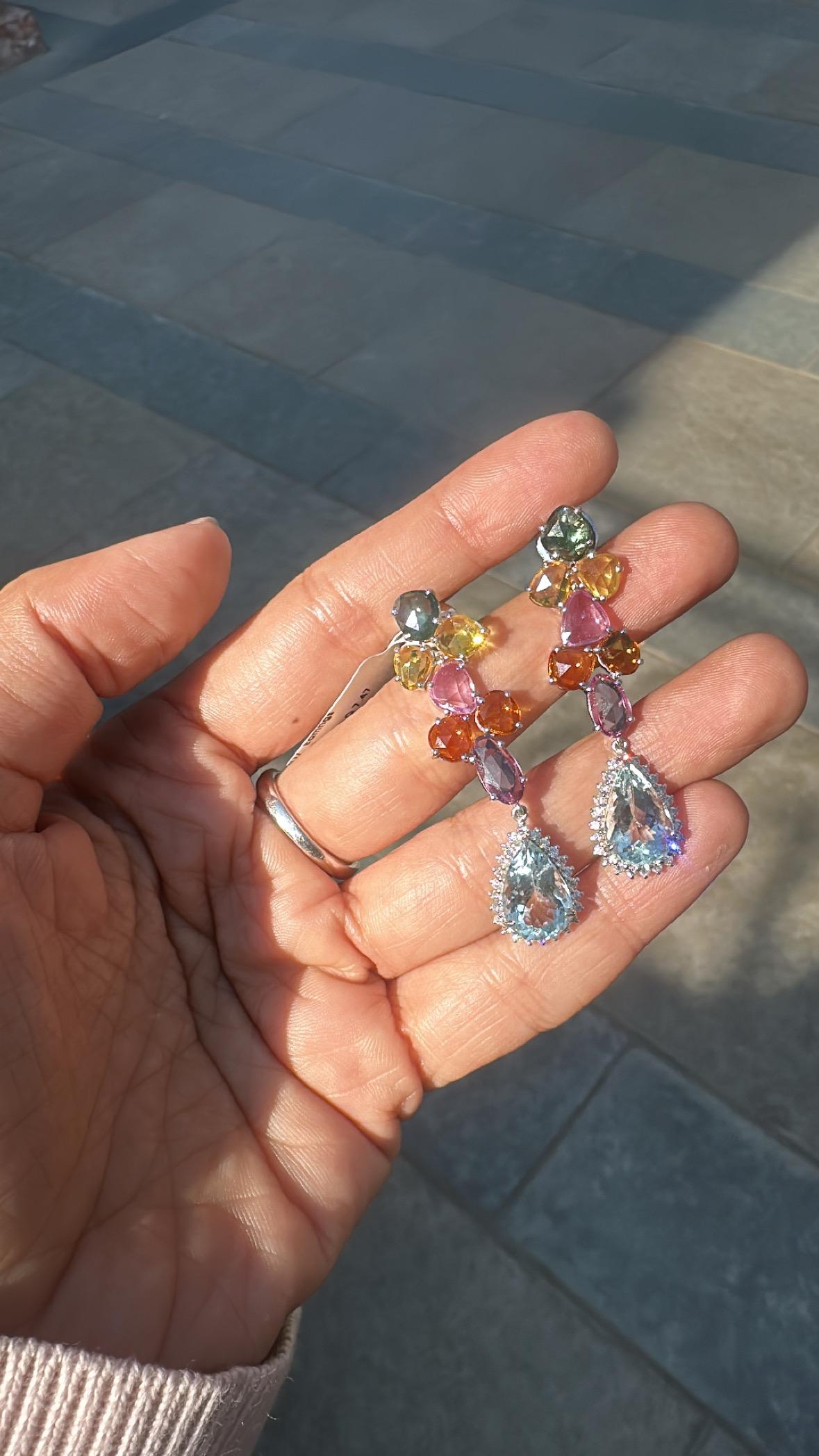 A very gorgeous and beautiful, modern style, Aquamarine & Multi Sapphires Chandelier Earrings set in 18K White Gold & natural Diamonds. The weight of the pear shaped Aquamarine is 7.47 carats. The weight of the Multi Sapphires is 10.77 carats. The