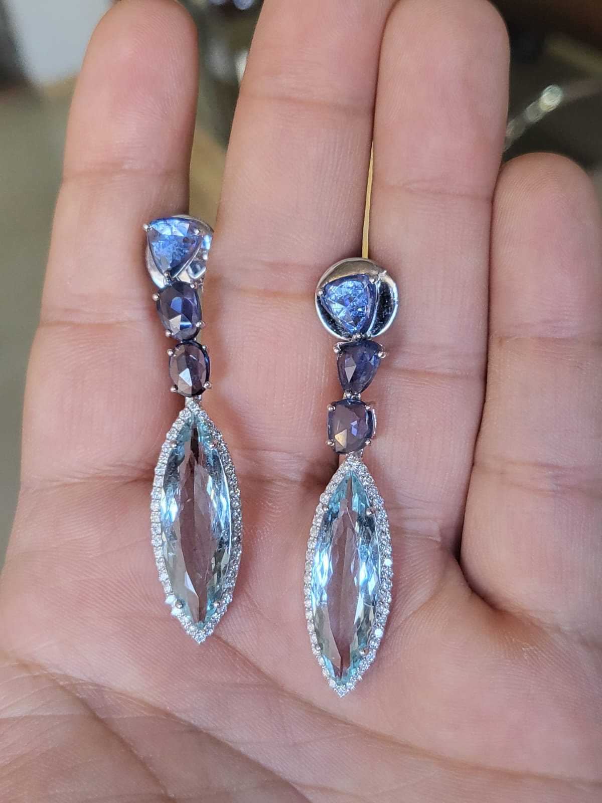 A very gorgeous and beautiful, Aquamarine & Blue Sapphires Dangle / Drop Earrings set in 18K White Gold & Diamonds. The weight of the marquise shaped Aquamarines is 11.54 carats. The weight of the Blue Sapphire Rose Cuts 5.59 carats. The Blue