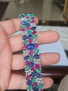 Set in 18K Gold, natural Blue Sapphire, Emerald, Ruby & Diamonds Link Bracelet