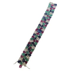 Set in 18K Gold, natural Blue Sapphire, Emerald, Ruby & Diamonds Link Bracelet