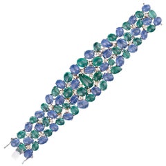 Set in 18K gold, Natural Emerald and Blue Sapphire cabochon flexible Bracelet