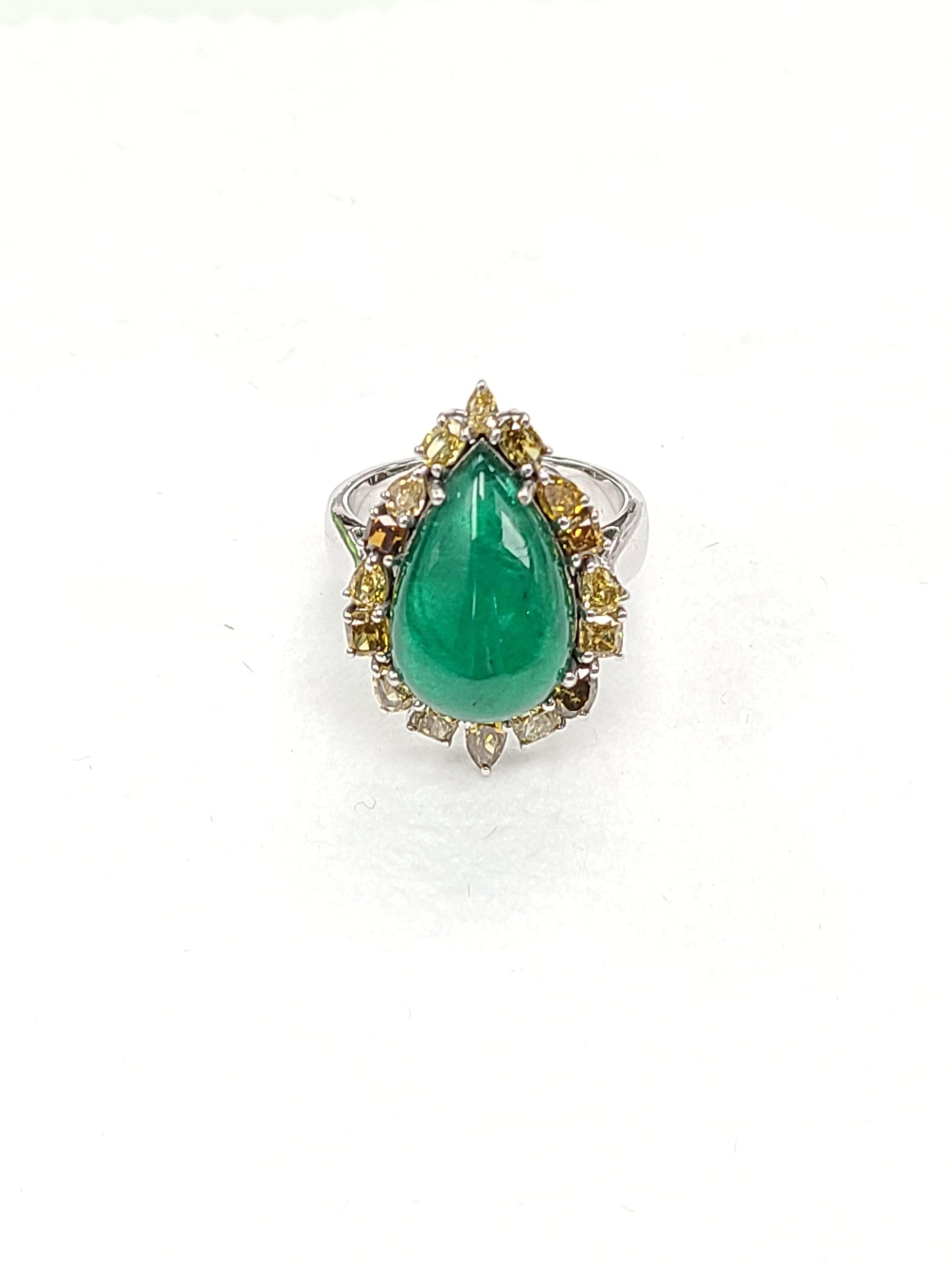 modern and chic emerald ring set with natural fancy color diamond . weight of emerald cabochon is 7.25 carats and color diamond is 1.48 carats. Ring size US 61/2 , can be altered on request.