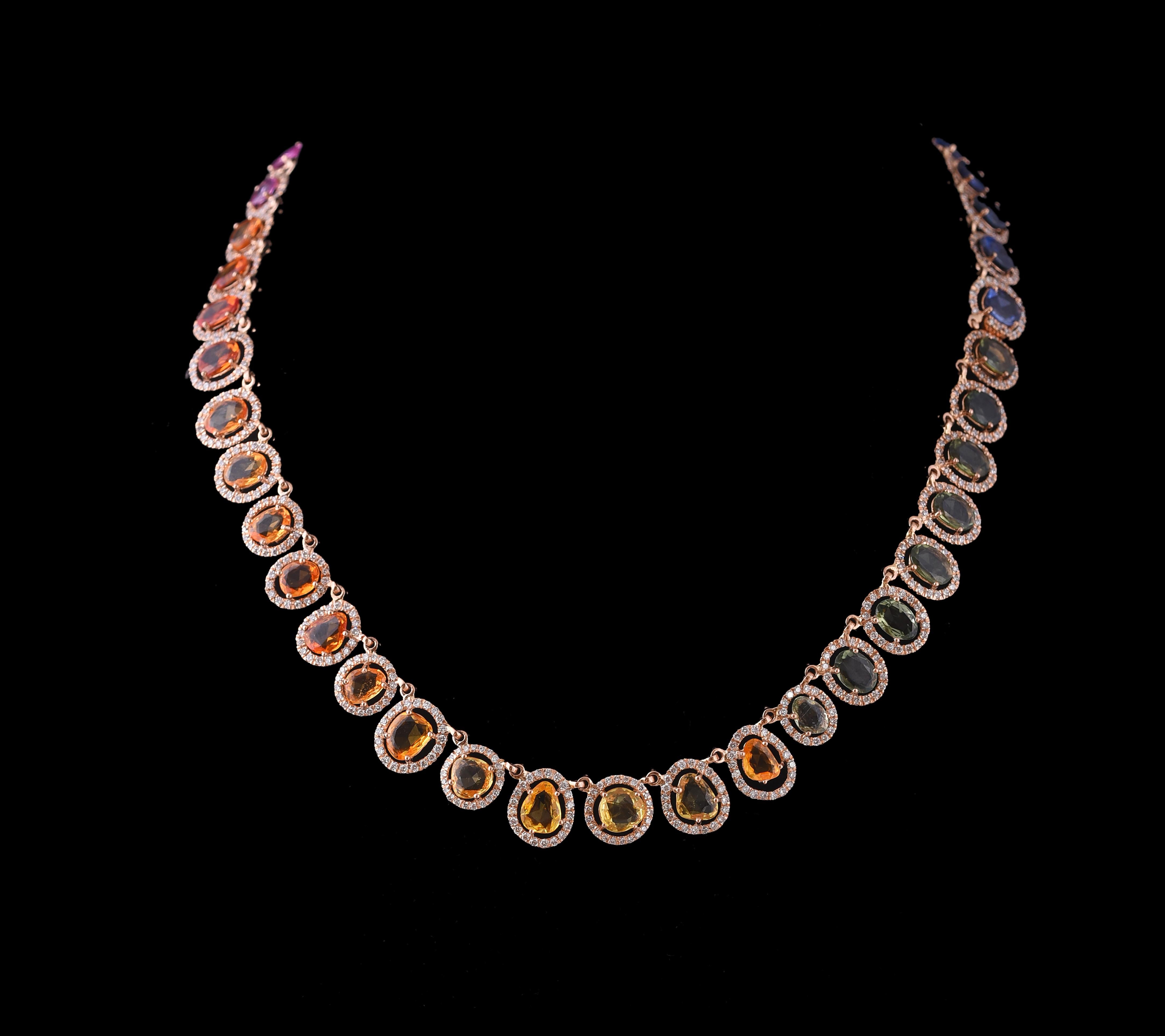 A very simple yet gorgeous Multi Sapphire necklace set in 18K Gold and Diamonds. The colours of the Multi- Sapphires include Blue, Green, Grey, Pink, Orange and Yellow. All the sapphires are natural and without any treatment. Because the necklace