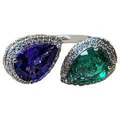 Set in 18K Gold, Natural Pear Shaped Emerald, Tanzanite 
Diamonds Cocktail Ring