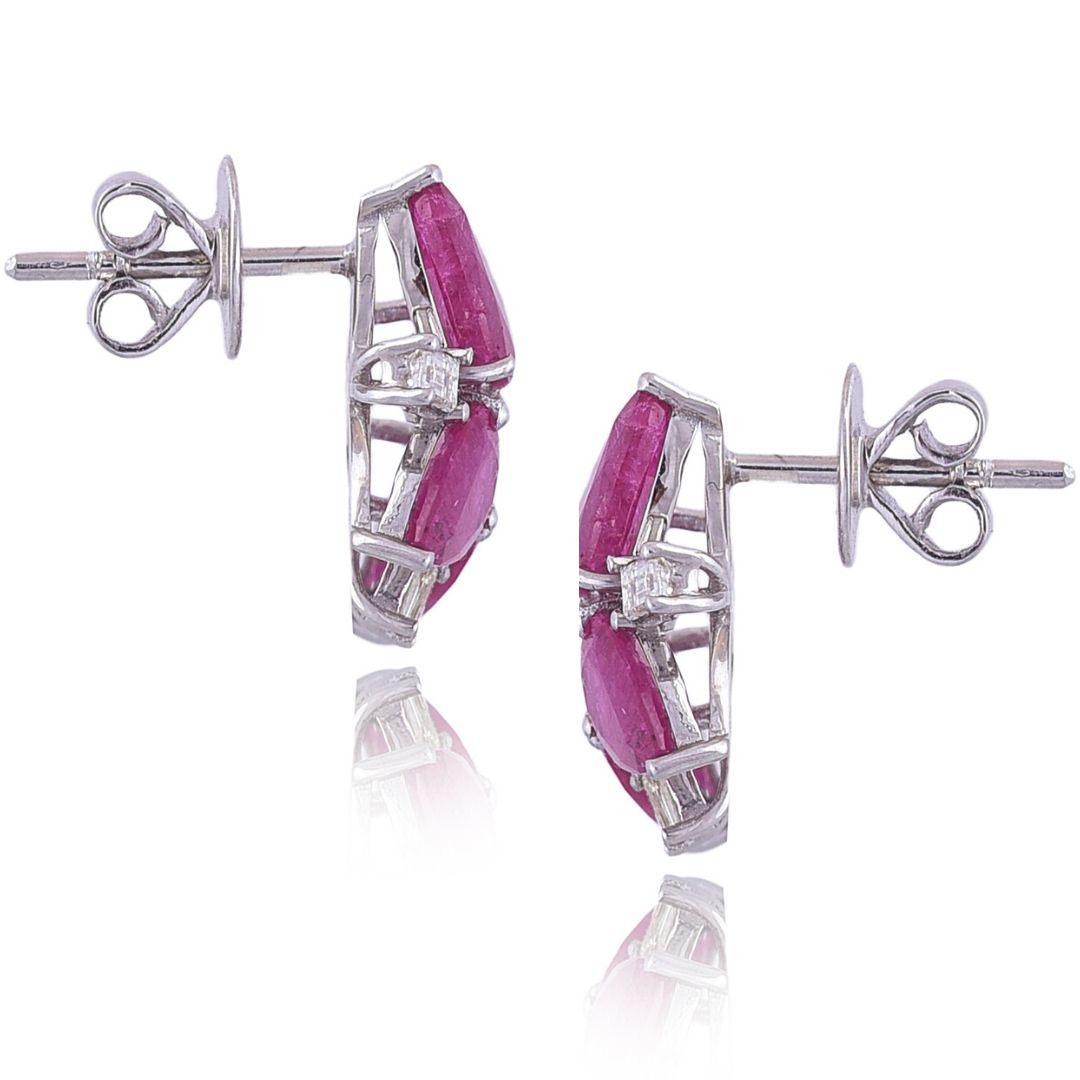 A very chic pair of natural Ruby and Diamond Earrings set in 18K gold. The weight of the Rubies is 5.68 carats. The Rubies are of Mozambique origin and are completely natural without any treatment. The weight of the Diamonds is 0.51 carats. The