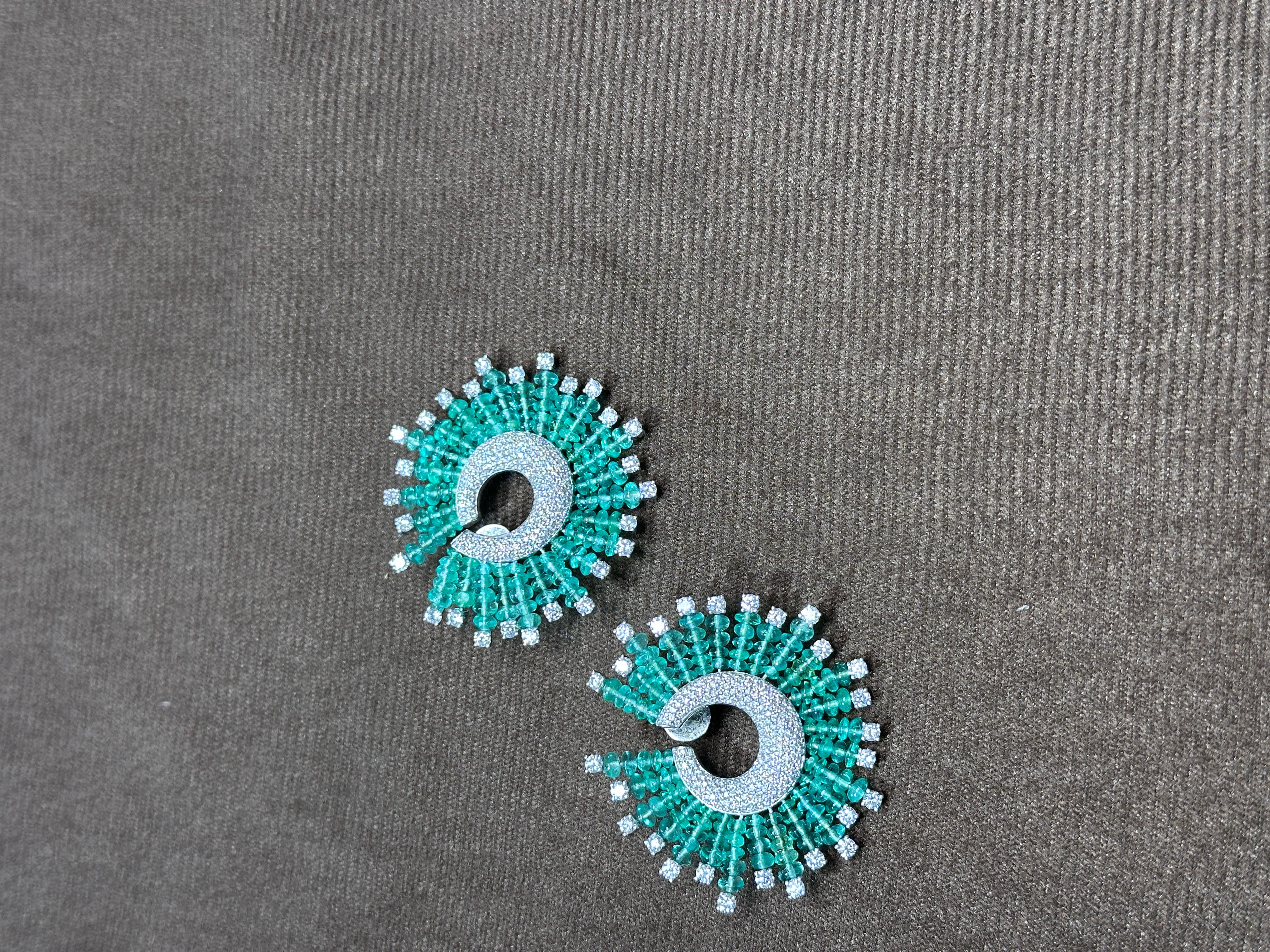 A very gorgeous and beautiful, modern style, Emerald Stud Hoop oversized Earrings set in 18K White Gold & natural Diamonds. The weight of the Emerald beads is 36.23 carats. The Emeralds are completely natural, without any treatment and are of