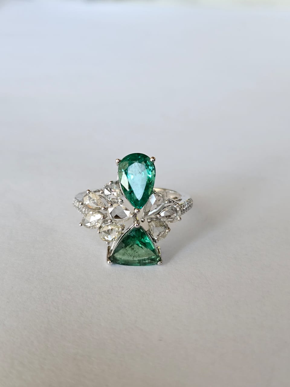 A very gorgeous and beautiful, Emerald Engagement Ring set in 18K White Gold & Diamonds. The weight of the Emeralds is 2.84 carats. The Emeralds are completely natural, without any treatment and are of Zambian origin. The combined Diamonds weight is