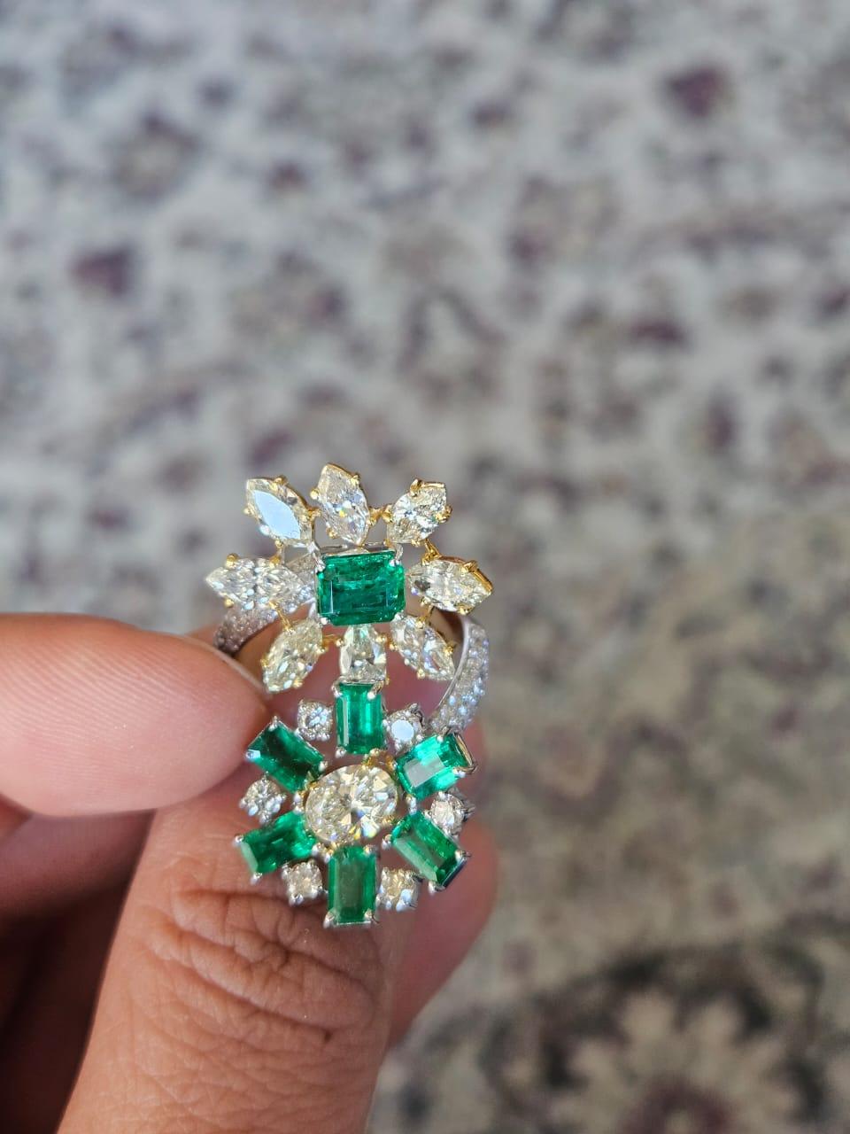 A very gorgeous and beautiful, modern style, Emerald Cocktail Ring set in 18K Gold & Yellow Diamonds. The weight of the Emeralds is 2.68 carats. The Emeralds are completely natural, without any treatment and is of Zambian origin. The combined