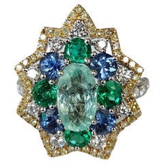 Set in 18K Gold, Paraiba, Blue Sapphires, Emerald 
Diamond Engagement Ring