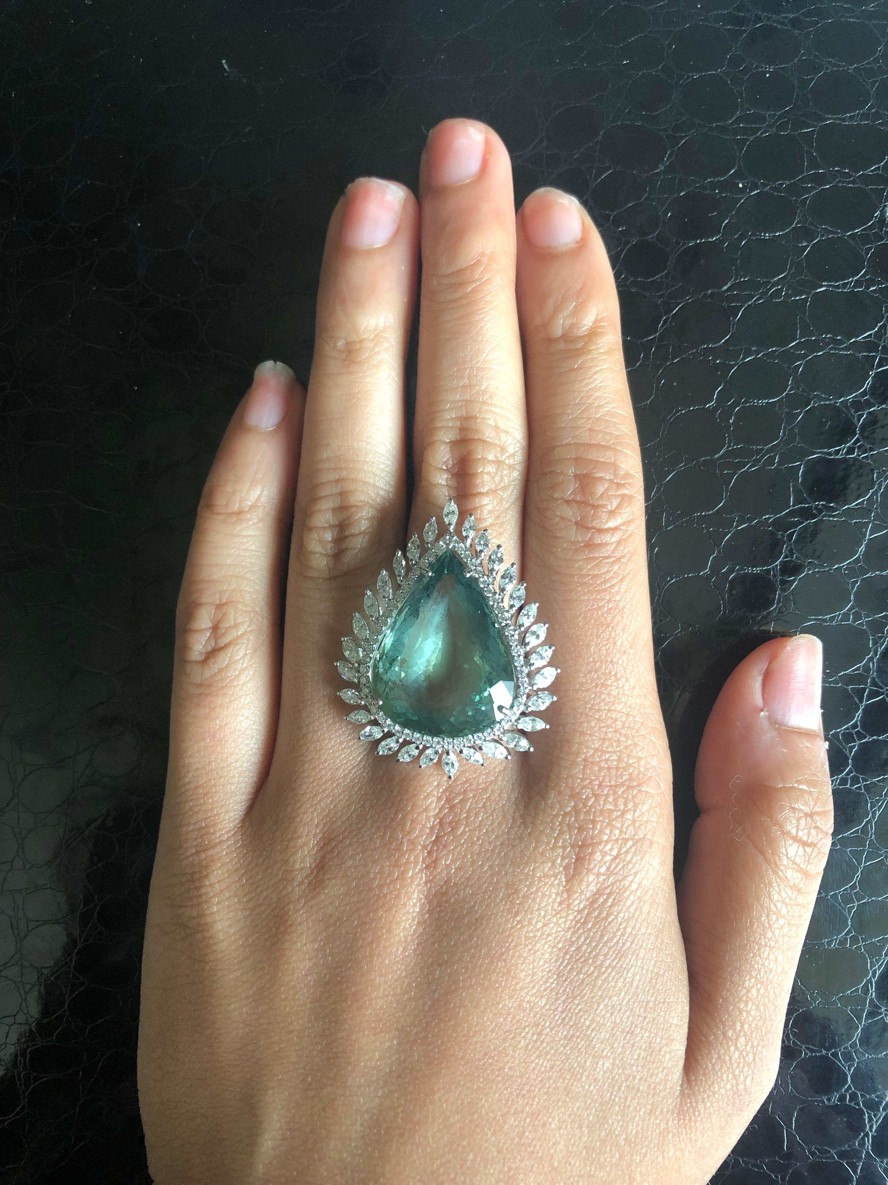 Modern Set in 18K gold, pear shaped green aquamarine and marquise diamond cocktail ring