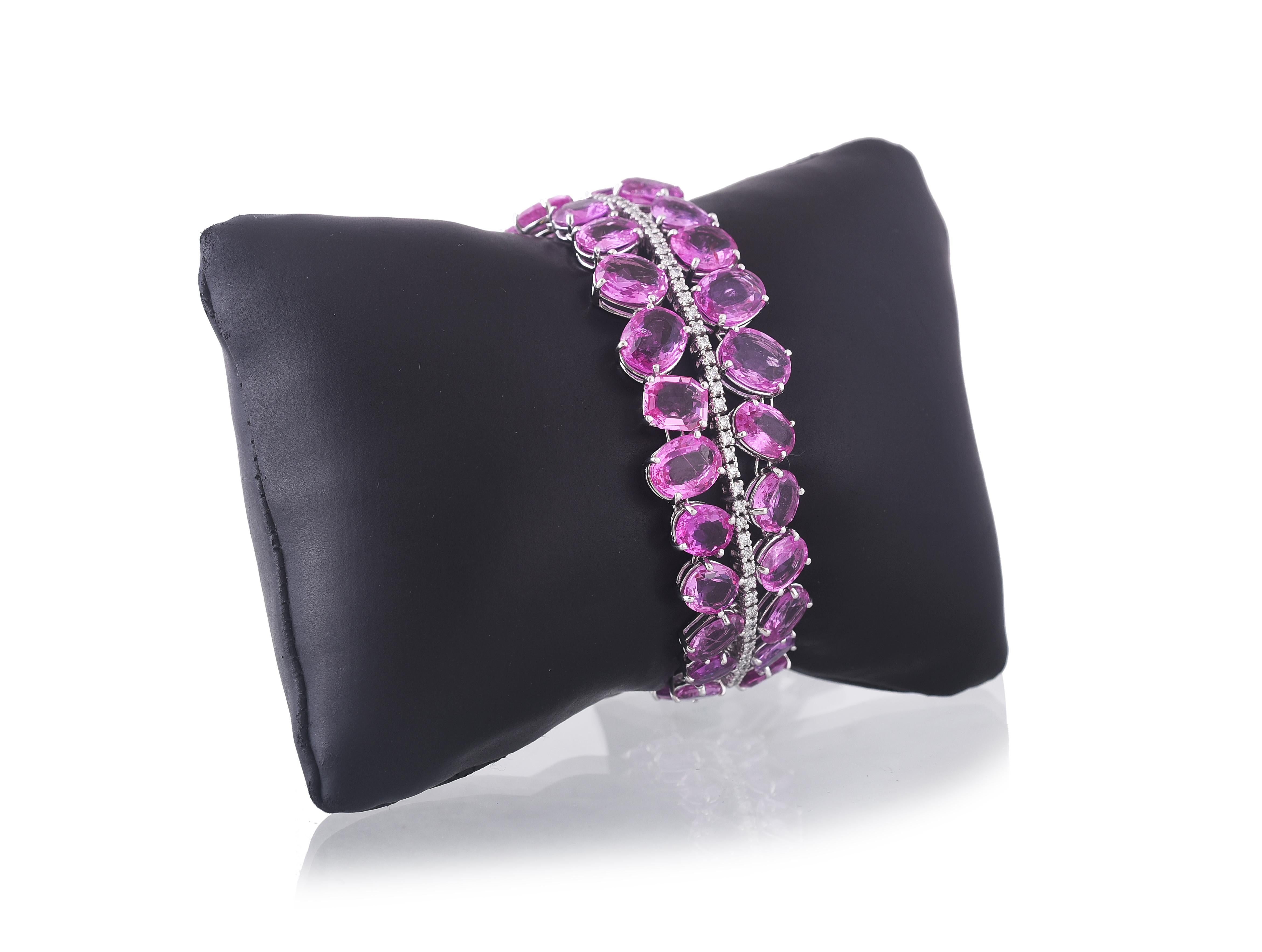 A gorgeous Pink Sapphire Rose Cut and Diamonds Bracelet set in 18K gold. The Pink sapphire is natural, a mix of heat and non-heat, originating from Madagascar, Africa. The weight of the Pink Sapphire is 68.61 carats. The total weight of the diamonds