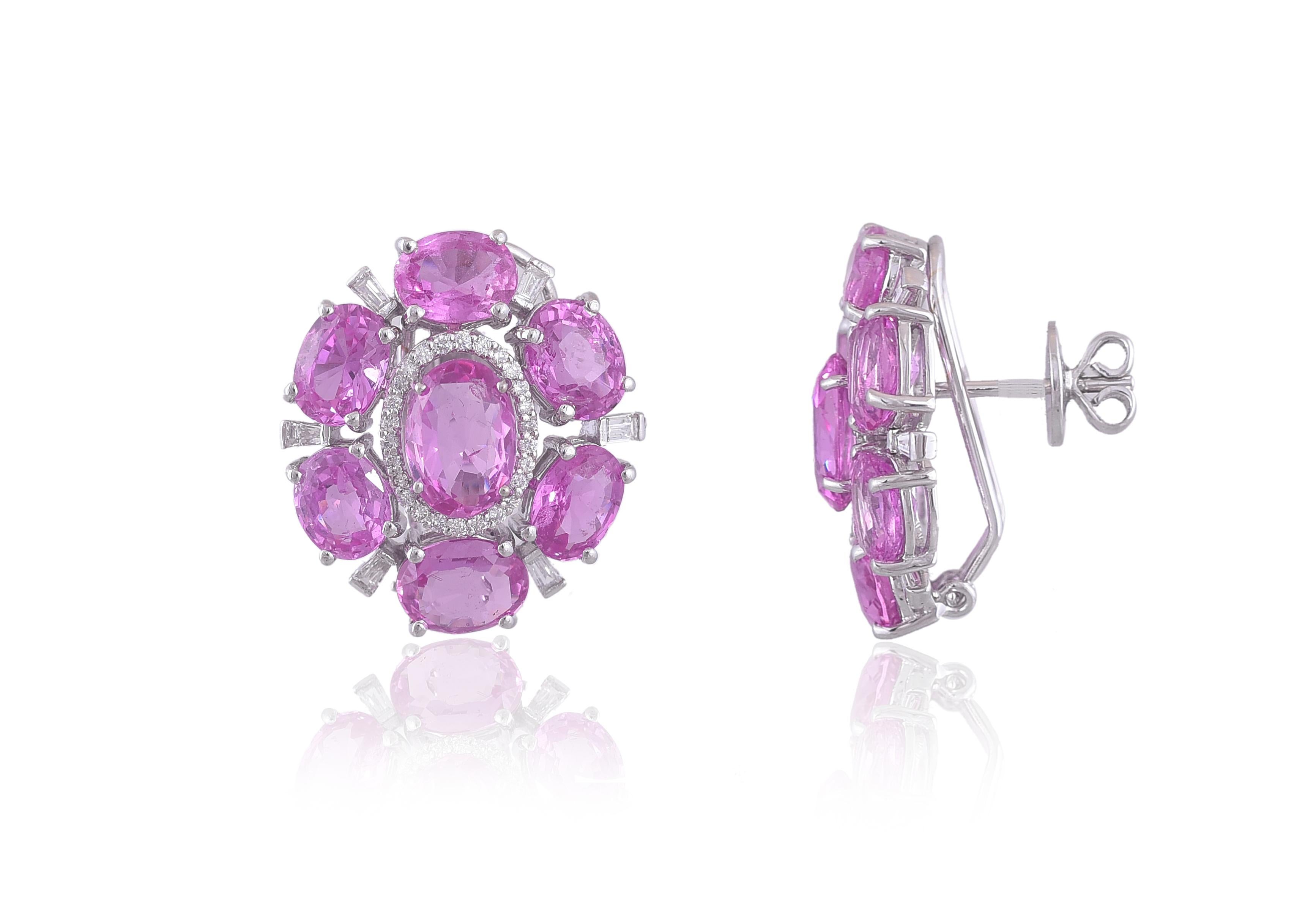 A very chic pair of Pink Sapphire Stud Earrings set in 18K gold and Diamonds. The weight of the pink sapphires is 21.83 carats. The sapphires are natural, from Madagascar. The weight of the diamonds is 0.75 carats. The earrings have a clip back and