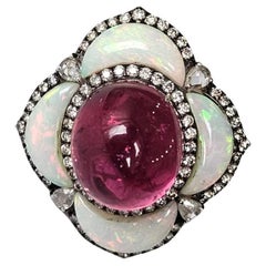 Set in 18K Gold, Rubellite Cabochon, Ethiopian Opal 
Diamonds Cocktail Ring