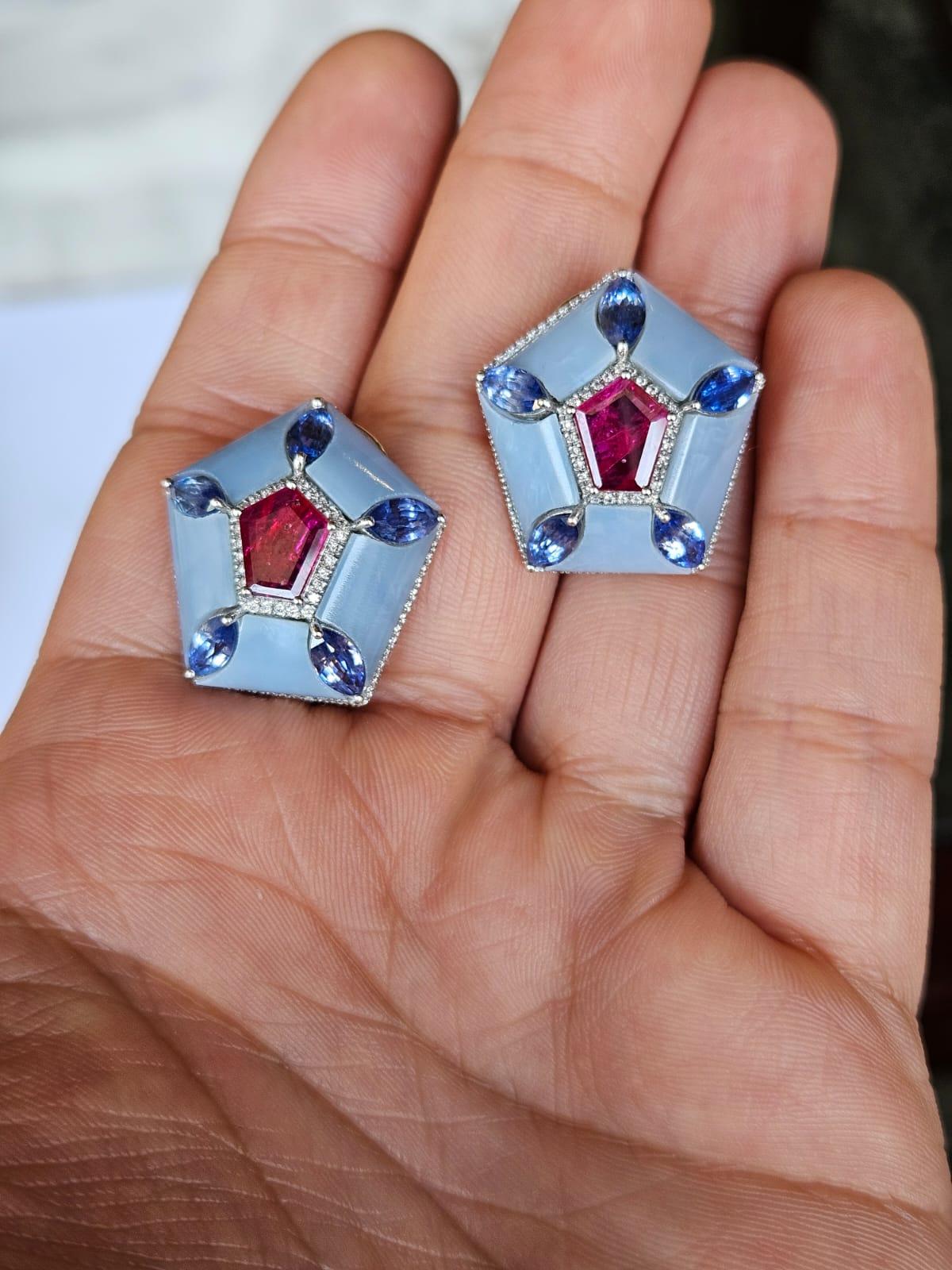 A very gorgeous and beautiful, modern style, Ruby, Blue Sapphires & Blue Opals Stud Earrings set in 18K Gold & natural Diamonds. The weight of the Rubies is 2.70 carats. The Rubies are completely natural, without any treatment and are of Mozambique