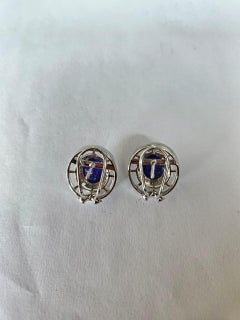 Orecchini con cabochon di tanzanite, cristallo di rocca e diamanti, incastonati in oro 18 carati