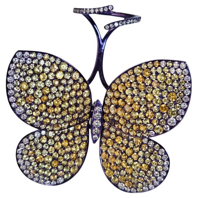 Anello con farfalla "Flutter" in oro 18 carati e titanio, zaffiri gialli e diamanti