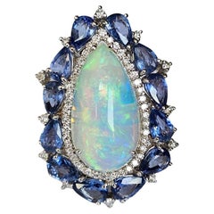 Set in 18K Gold, white Ethiopian Opal, Blue Sapphires & Diamonds Cocktail Ring