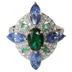 Set in 18K Gold, Zambian Emerald, Blue Sapphires 
Diamonds Engagement Ring