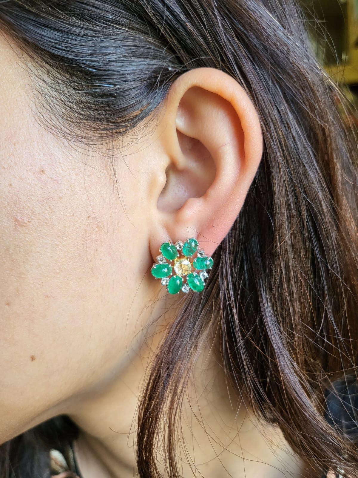 A very beautiful and dainty Emerald Stud Earrings set in 18K White Gold & Diamonds. The weight of the Emerald cabochons is 5.45 carats. The Emeralds are completely natural without any treatment, and is of Zambian origin. The weight of the Rose cut