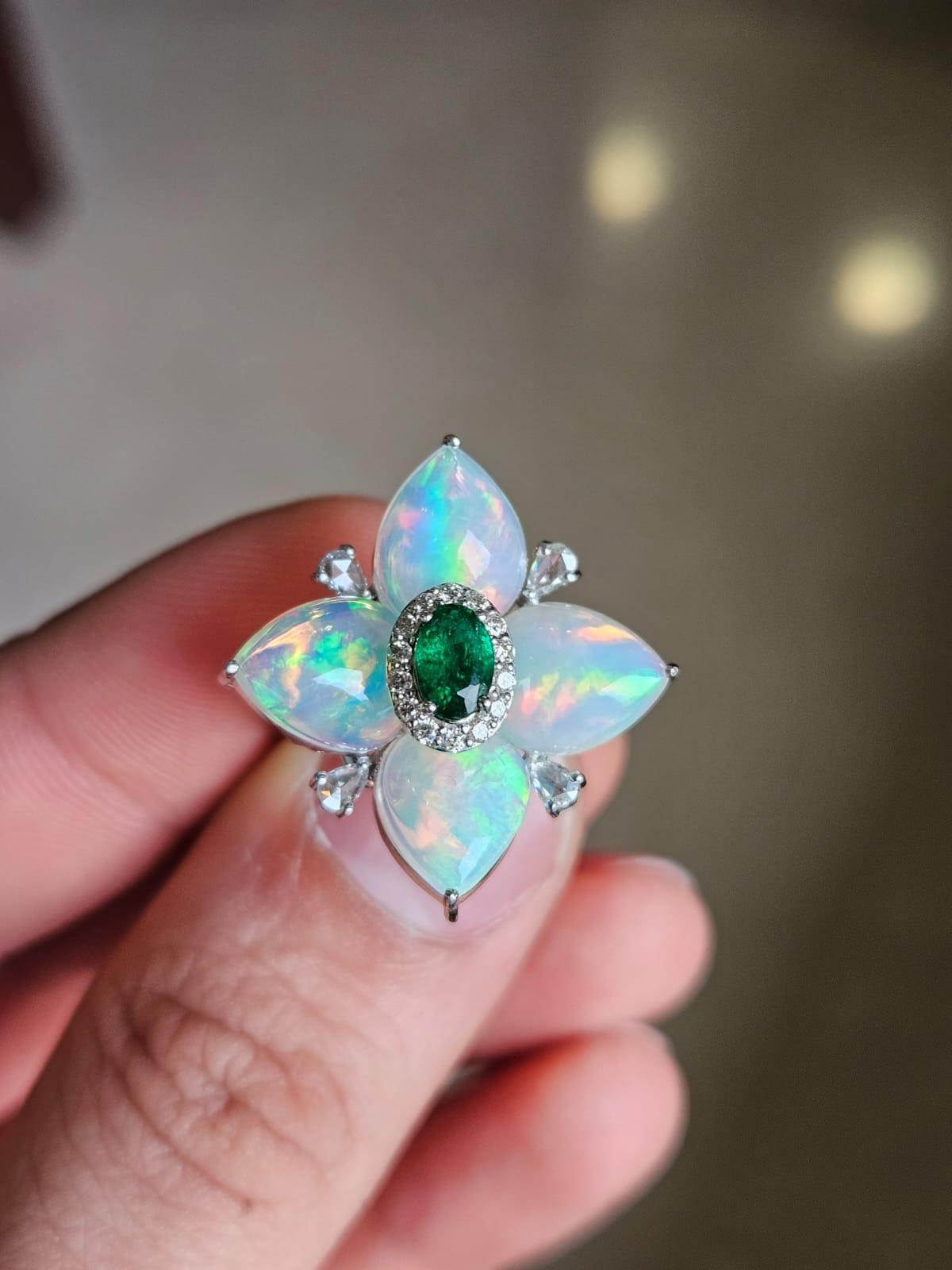 A very gorgeous and beautiful, Emerald & Opal Cocktail Ring set in 18K White Gold & natural Diamonds. The weight of the deep - hued Emerald is 0.40 carats. The Emerald is completely natural, without any treatment & is of Zambian origin. The weight