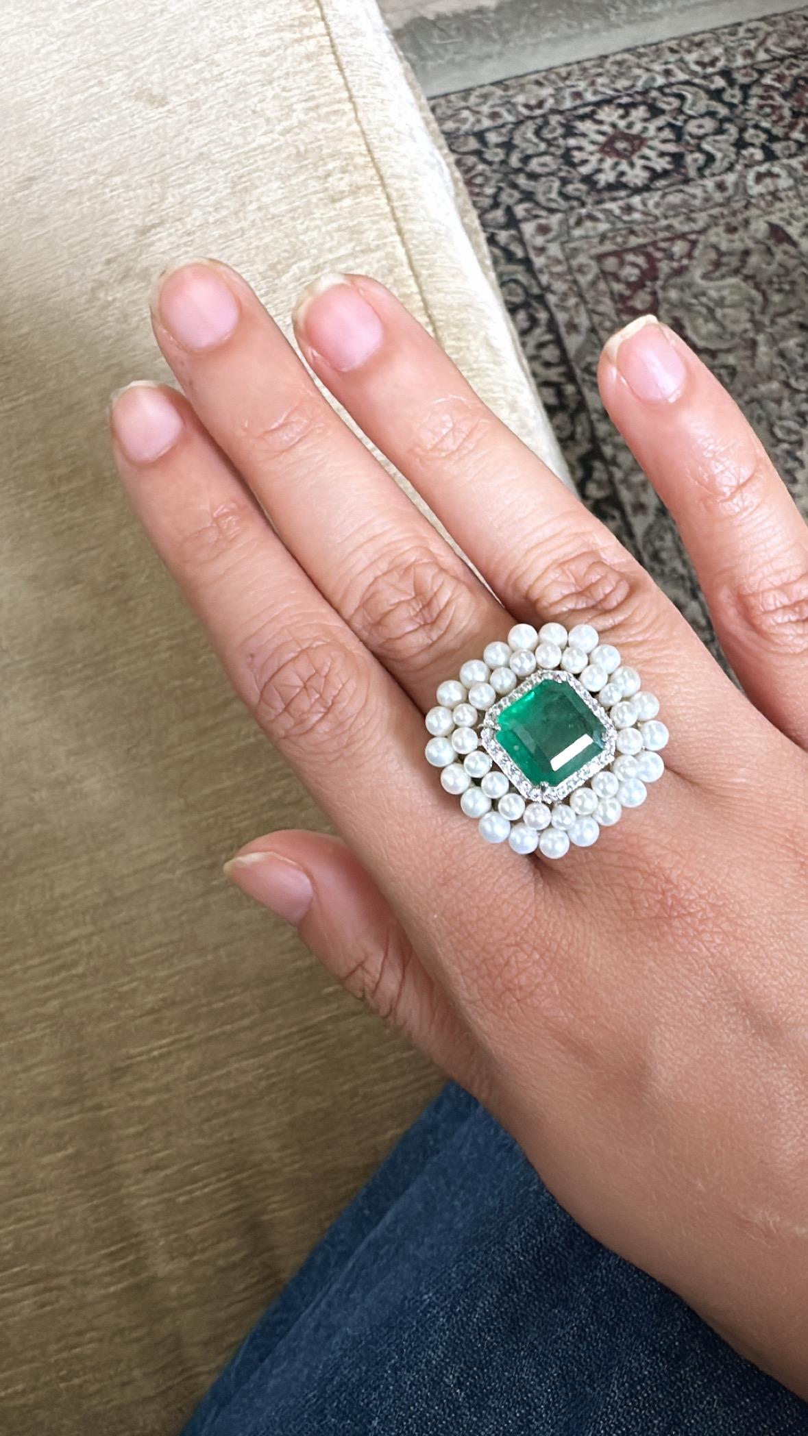 A very gorgeous and beautiful, modern style, Emerald Cocktail Ring set in 18K White Gold & natural Diamonds. The weight of the Emerald is 5.03 carats. The Emerald is completely natural, without any treatment and is of Zambian origin. The weight of