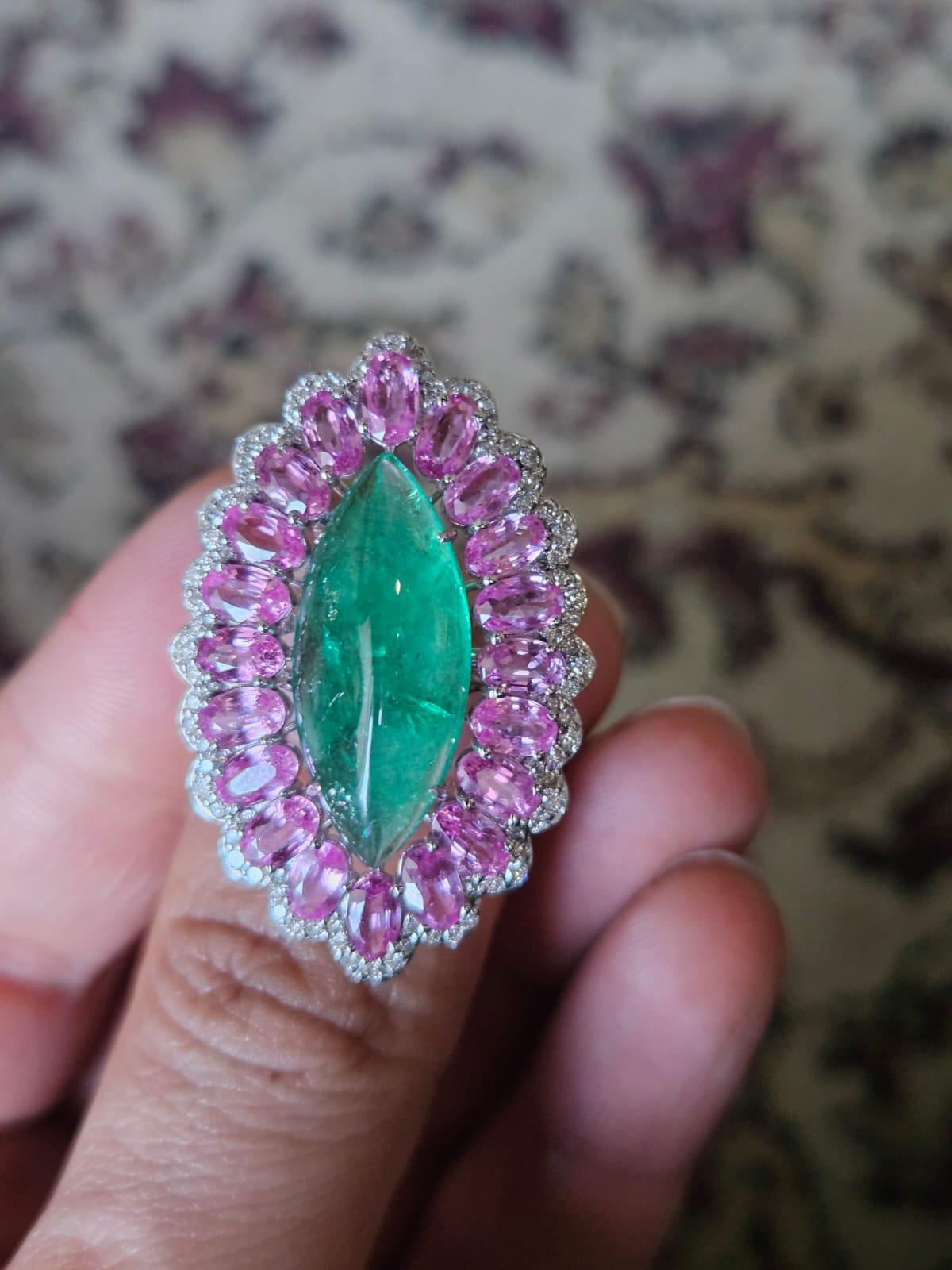 A very gorgeous and beautiful, classic style, Emerald & Pink Sapphire Cocktail Ring set in 18K White Gold & Diamonds. The weight of the marquise shaped Emerald cabochon is 6.72 carats. The Emerald is completely natural, without any treatment and is
