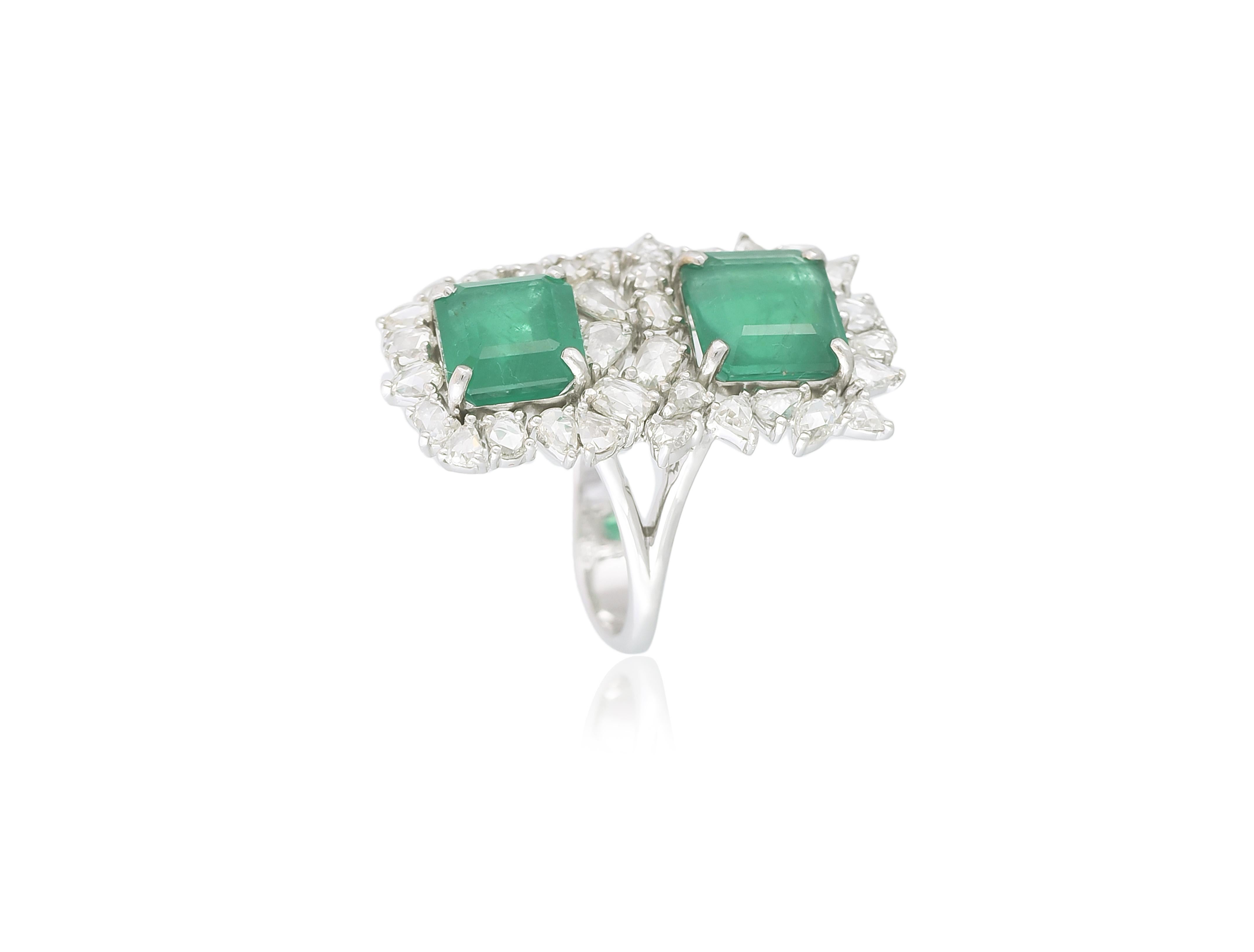 A very chic piece of cocktail ring set with Zambian Emeralds & Rose Cut Diamonds set in 18K Gold. The Emeralds are natural, without any treatment and of Zambian origin. The total weight of the Emeralds is 6.83 carats. The weight of the Rose Cut