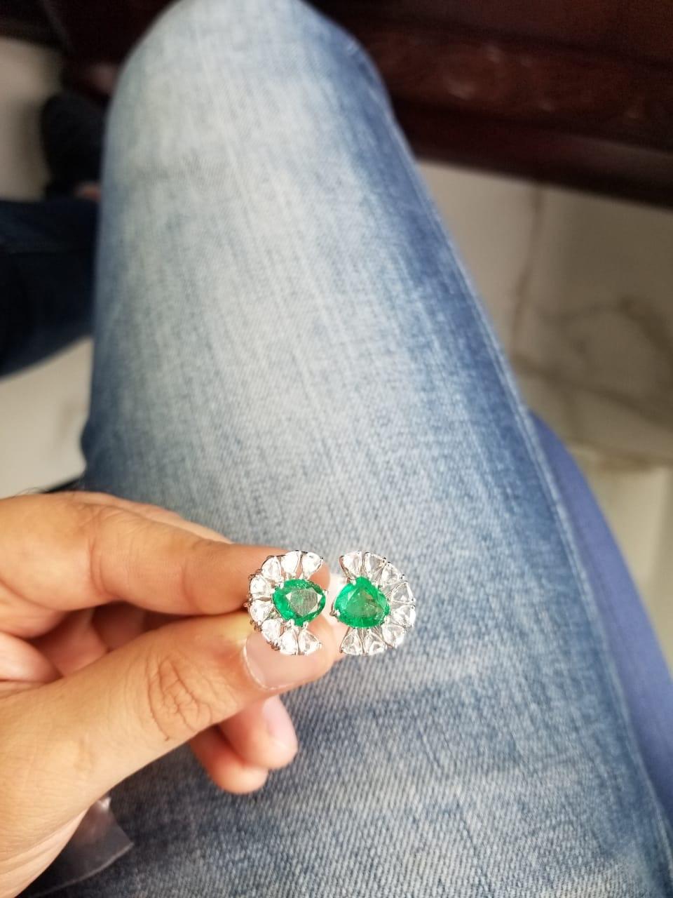 A very chic Zambian Emerald & Rose Cut Diamonds Two - Finger Cocktail Ring Set in 18K white gold. The weight of the Emeralds is 4.05 carats. The weight of the Diamonds is 1.75 carats. The ring is made in Indian ring size 12 (US size 6), and can be