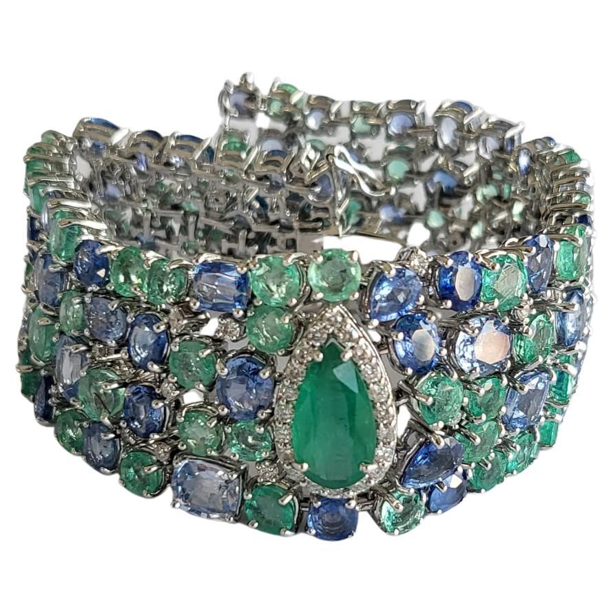 Set in 18k Gold, Zambian Emeralds, Blue Sapphires and Diamonds Modern Bracelets For Sale