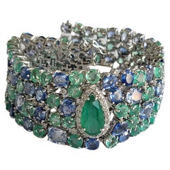 Set in 18k Gold, Zambian Emeralds, Blue Sapphires and Diamonds Modern Bracelets